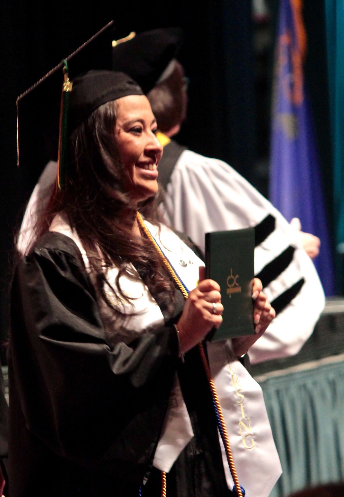 GBC nursing student shows diploma.jpg